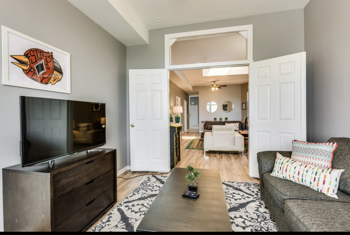 3140 West Fulton Street Chicago, IL 60612 - Photo 9 of 23 a living room with furniture and a flat screen tv
