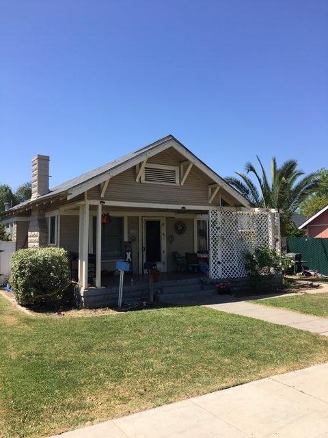 1315 D Street, Unit 2 Reedley, CA 93654 - Photo 2 of 4 a front view of a house with a garden