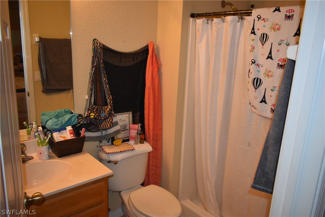 5264 Glenlivet Road Fort Myers, FL 33907 - Photo 12 of 15 a bathroom with a toilet and a sink