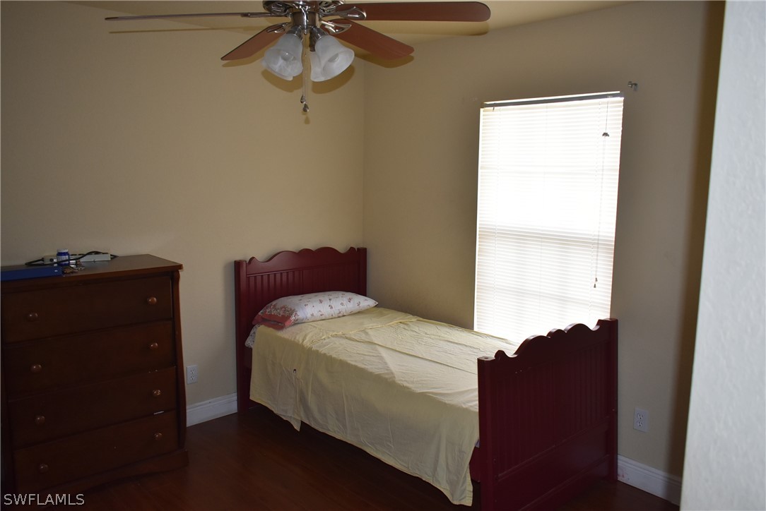 5264 Glenlivet Road Fort Myers, FL 33907 - Photo 13 of 15 a bedroom with a bed and a window