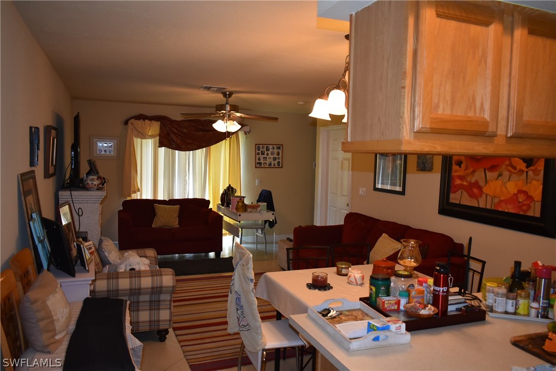 5264 Glenlivet Road Fort Myers, FL 33907 - Photo 2 of 15 a living room with furniture and a flat screen tv
