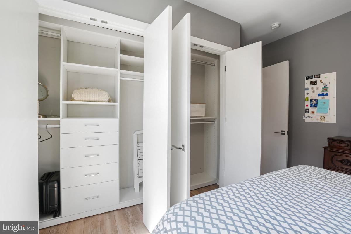 911 2nd Street Northeast, Unit 501 Washington, DC 20002 - Photo 16 of 30 a bedroom with a bed and a closet