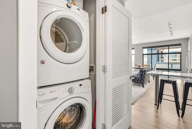 a view of a hallway with washer and dryer