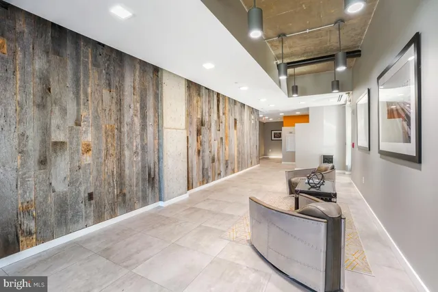 a view of a roof deck with dining table and chairs with wooden floor