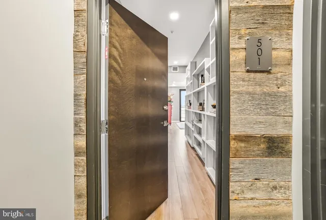 a bathroom with a glass door shower and a sink