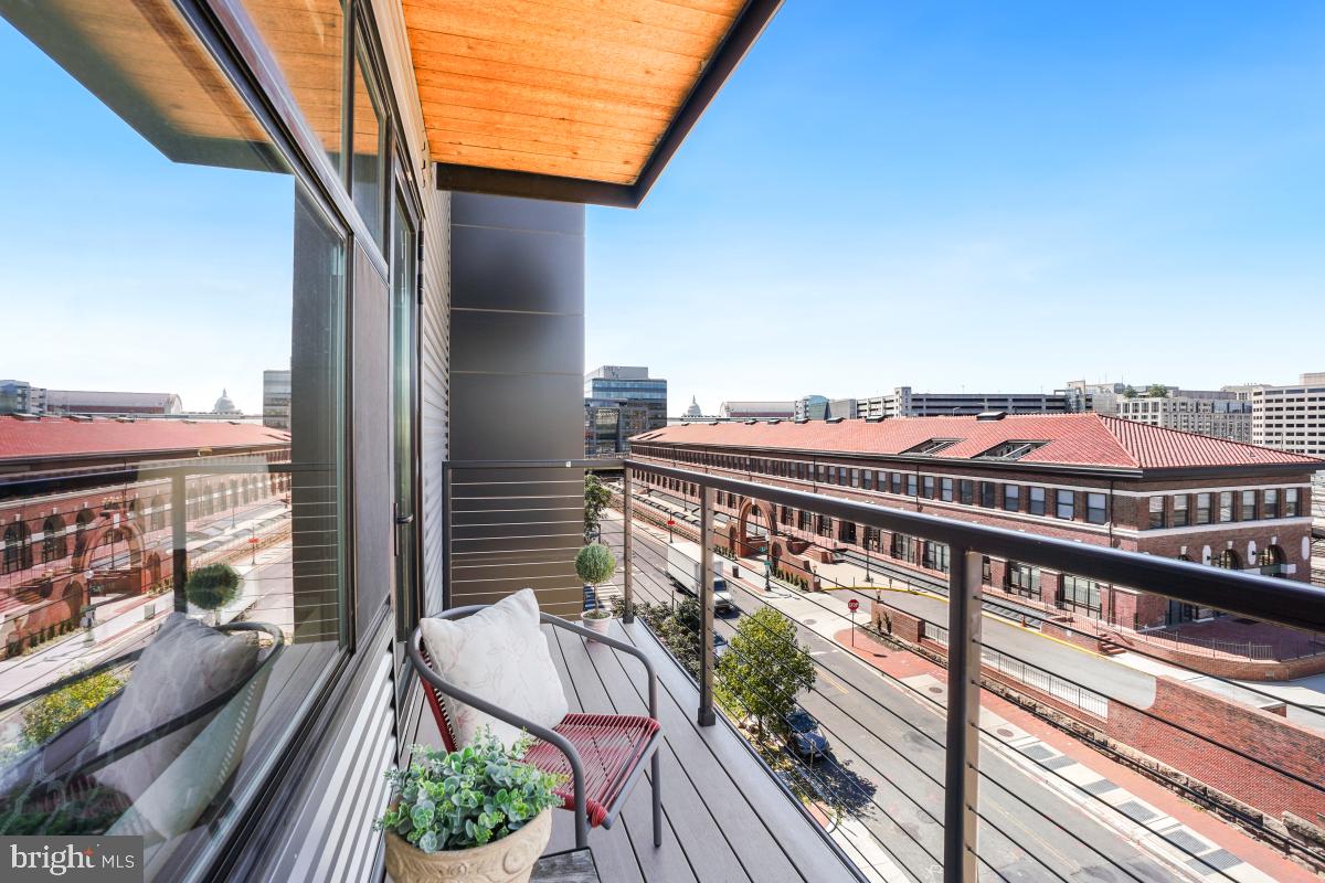 911 2nd Street Northeast, Unit 501 Washington, DC 20002 - Photo 10 of 30 a balcony with an outdoor seating