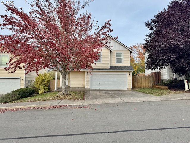 37355 Coralburst Street Sandy, OR 97055 - Photo 2 of 30 a front view of a house with a yard and garage