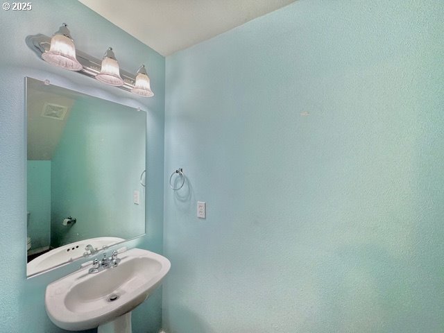 37355 Coralburst Street Sandy, OR 97055 - Photo 29 of 30 a bathroom with a sink and a mirror