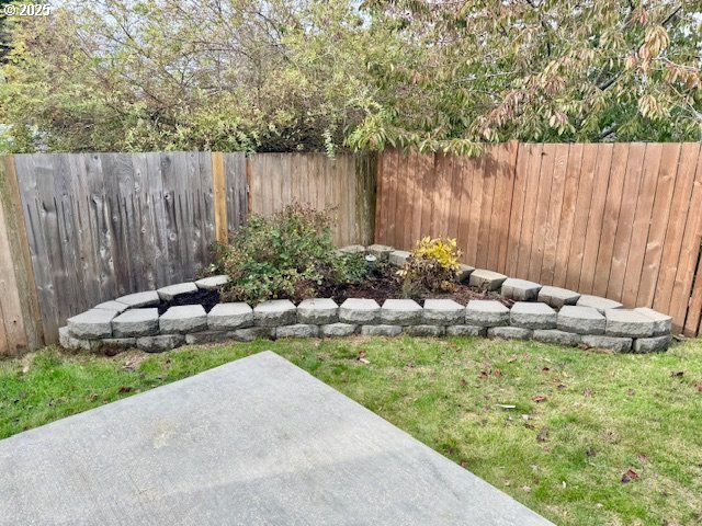 37355 Coralburst Street Sandy, OR 97055 - Photo 7 of 30 a garden with lots of trees and flowers