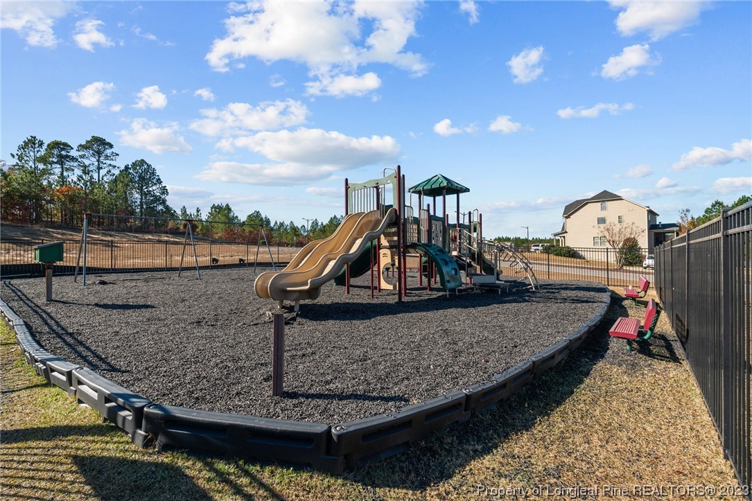 162 Old Montague Way Cameron, NC 28326 - Photo 14 of 16 a view of a swimming pool with a patio and a entertaining space