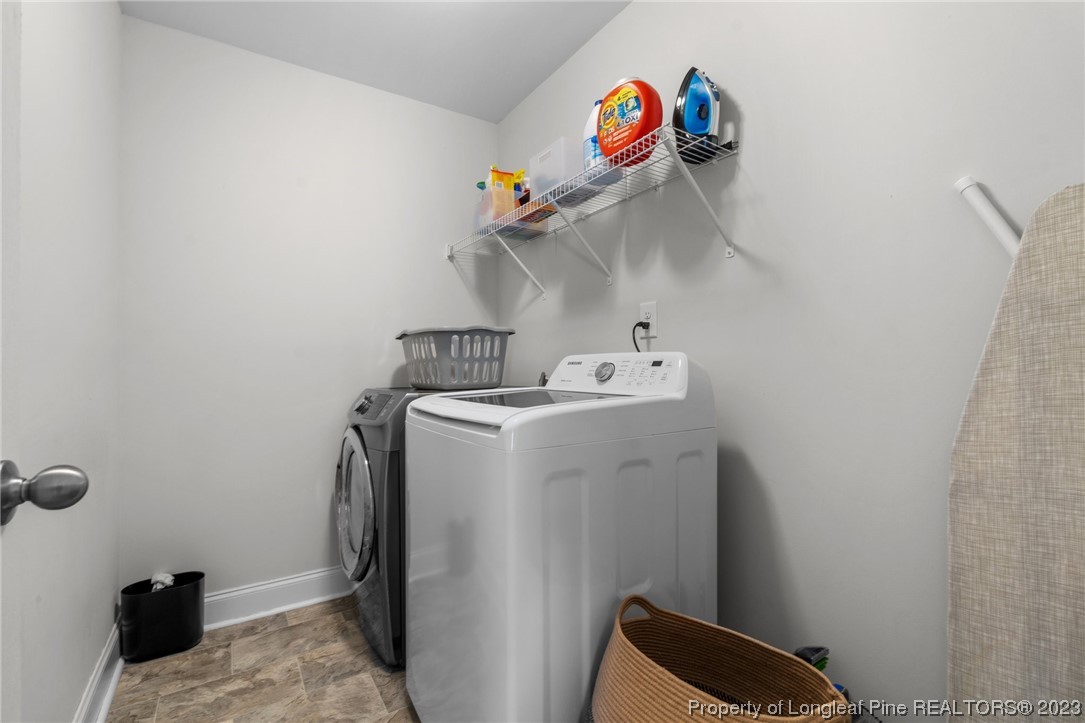 162 Old Montague Way Cameron, NC 28326 - Photo 7 of 16 a utility room with dryer and washer