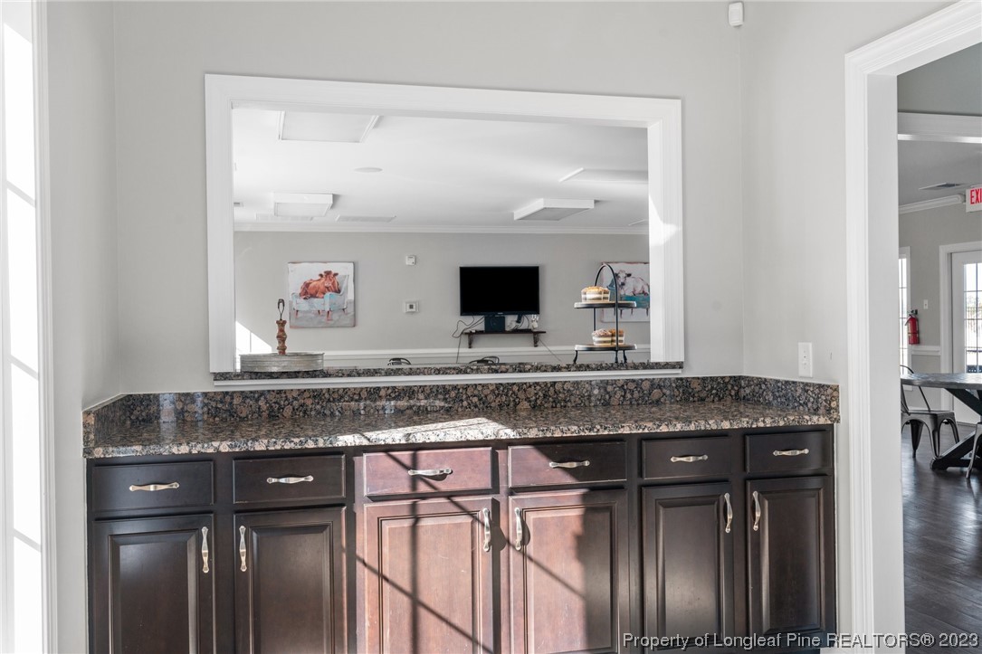 162 Old Montague Way Cameron, NC 28326 - Photo 10 of 16 a bathroom with a granite countertop sink and a mirror