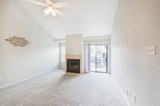 a view of empty room with fireplace