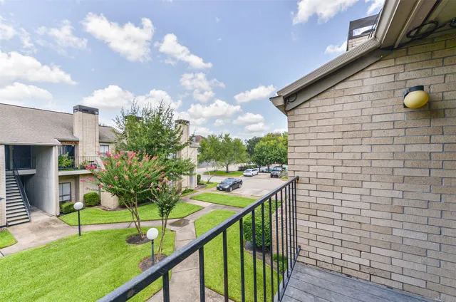 a view of hallway with wooden floor