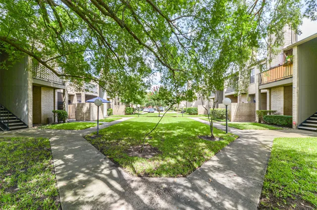 a view of a street with garage