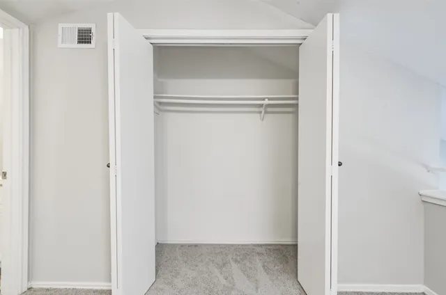 a view of a chair and table in the house front view