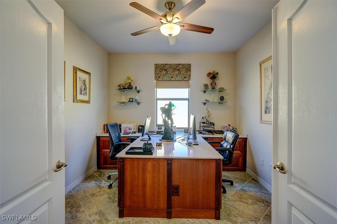 10655 Prato Drive Fort Myers, FL 33913 - Photo 5 of 49 a view of a workspace with furniture and a chandelier fan
