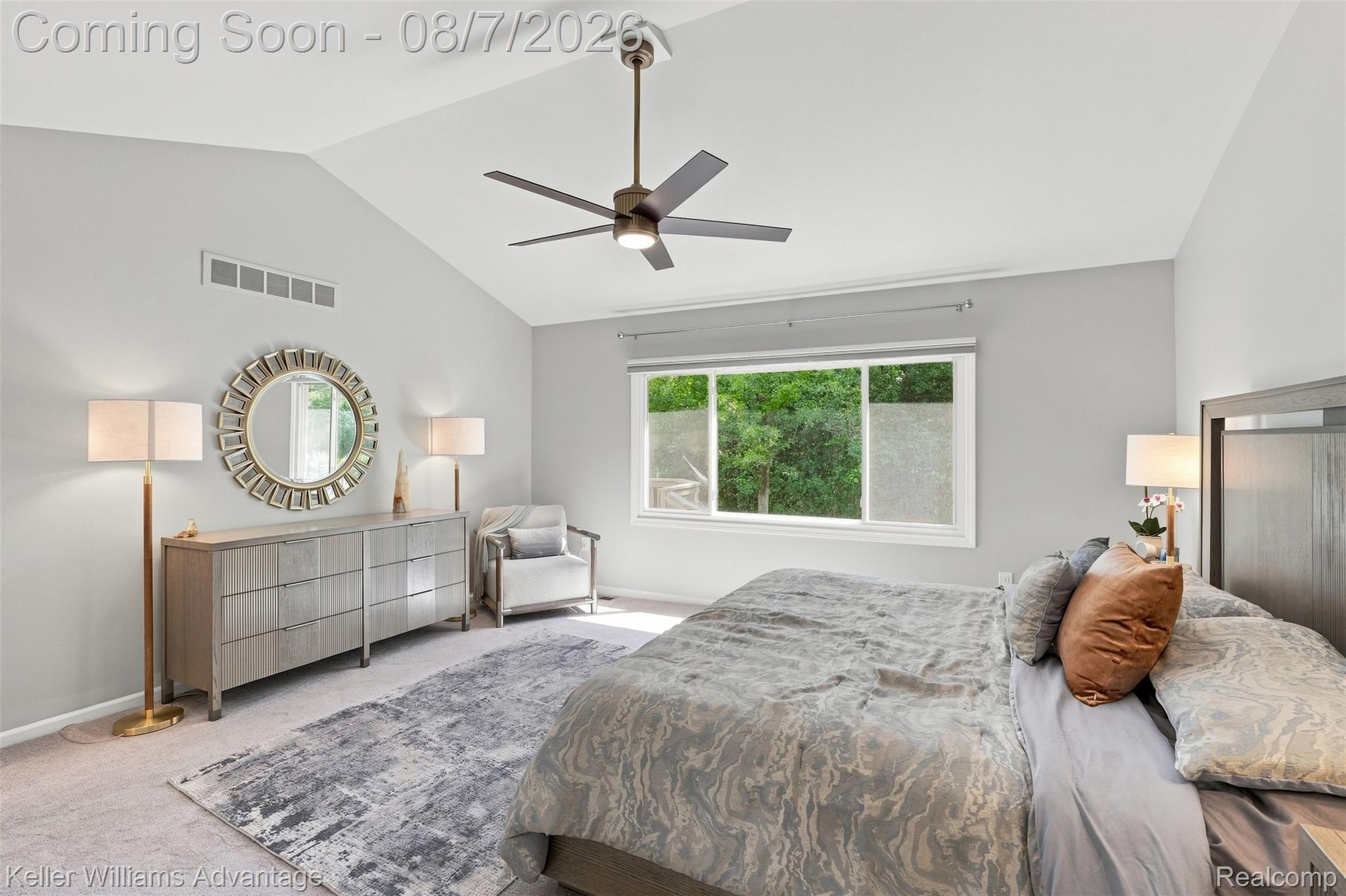 5325 Simpson Lake Road West Bloomfield, MI 48323 - Photo 28 of 43 Vaulted ceiling with a ceiling fan, broad window, and light gray wall paint