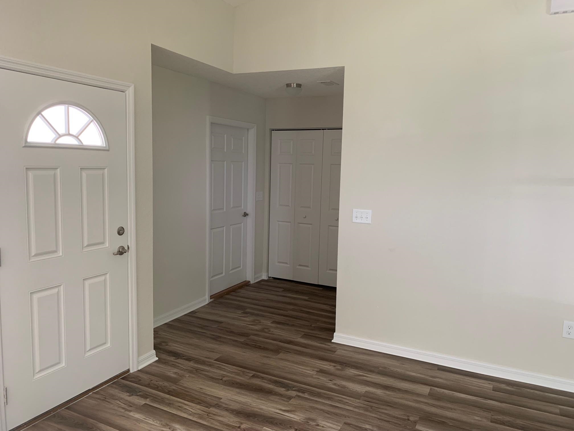 156 Gilbert Street St. Augustine, FL 32084 - Photo 11 of 35 a view of a hallway with wooden floor