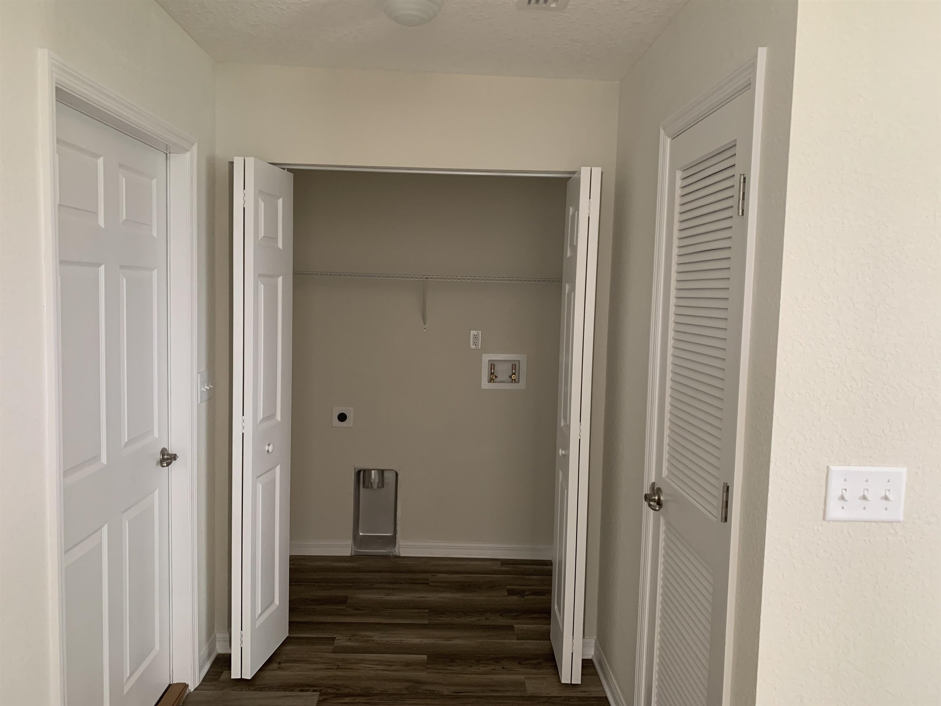 156 Gilbert Street St. Augustine, FL 32084 - Photo 12 of 35 a view of a hallway with wooden floor