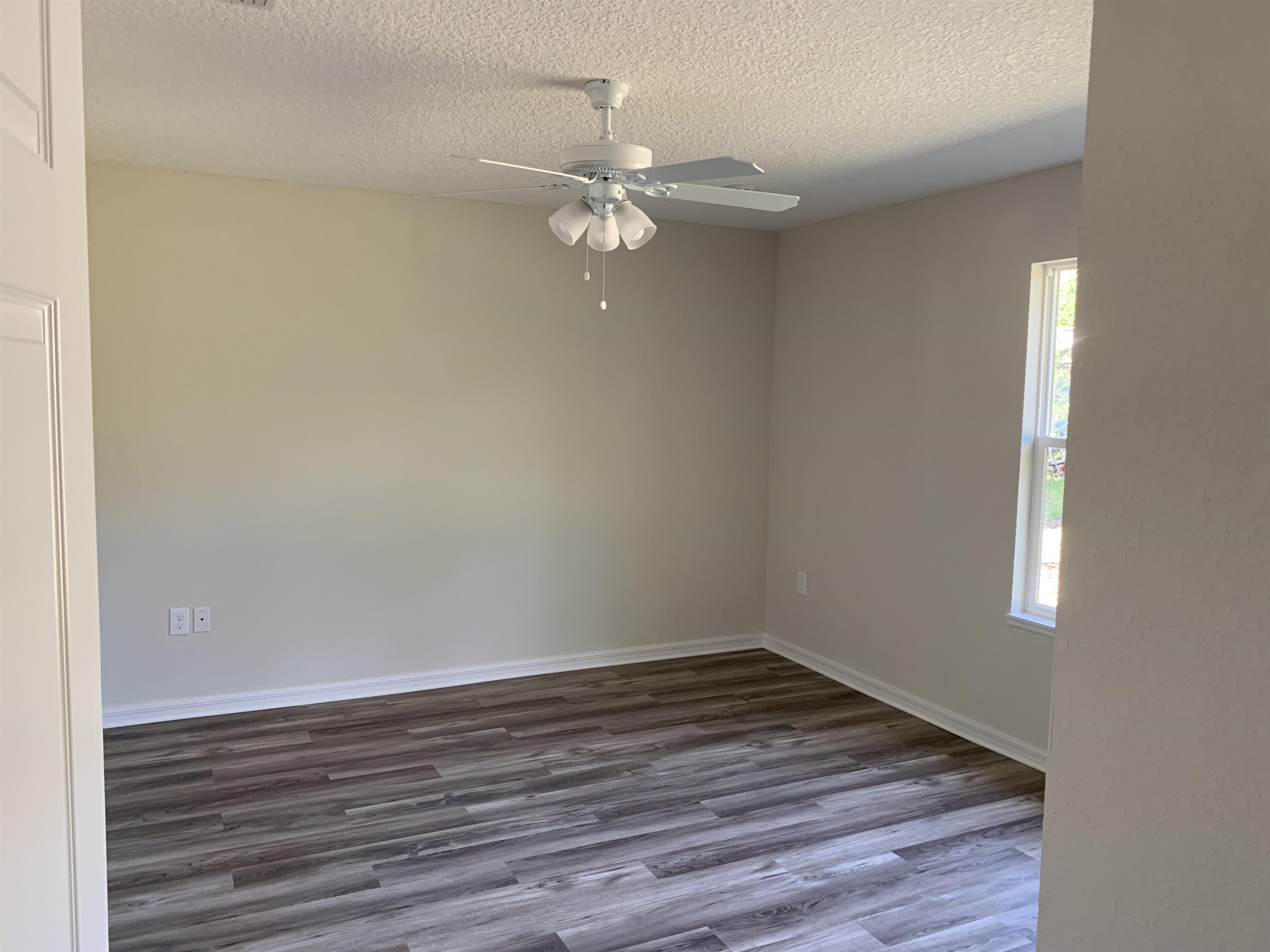 156 Gilbert Street St. Augustine, FL 32084 - Photo 17 of 35 a view of a room with wooden floor and fan