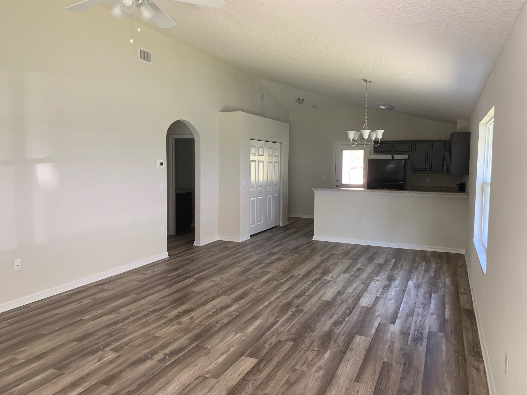 156 Gilbert Street St. Augustine, FL 32084 - Photo 2 of 35 a view of empty room with wooden floor