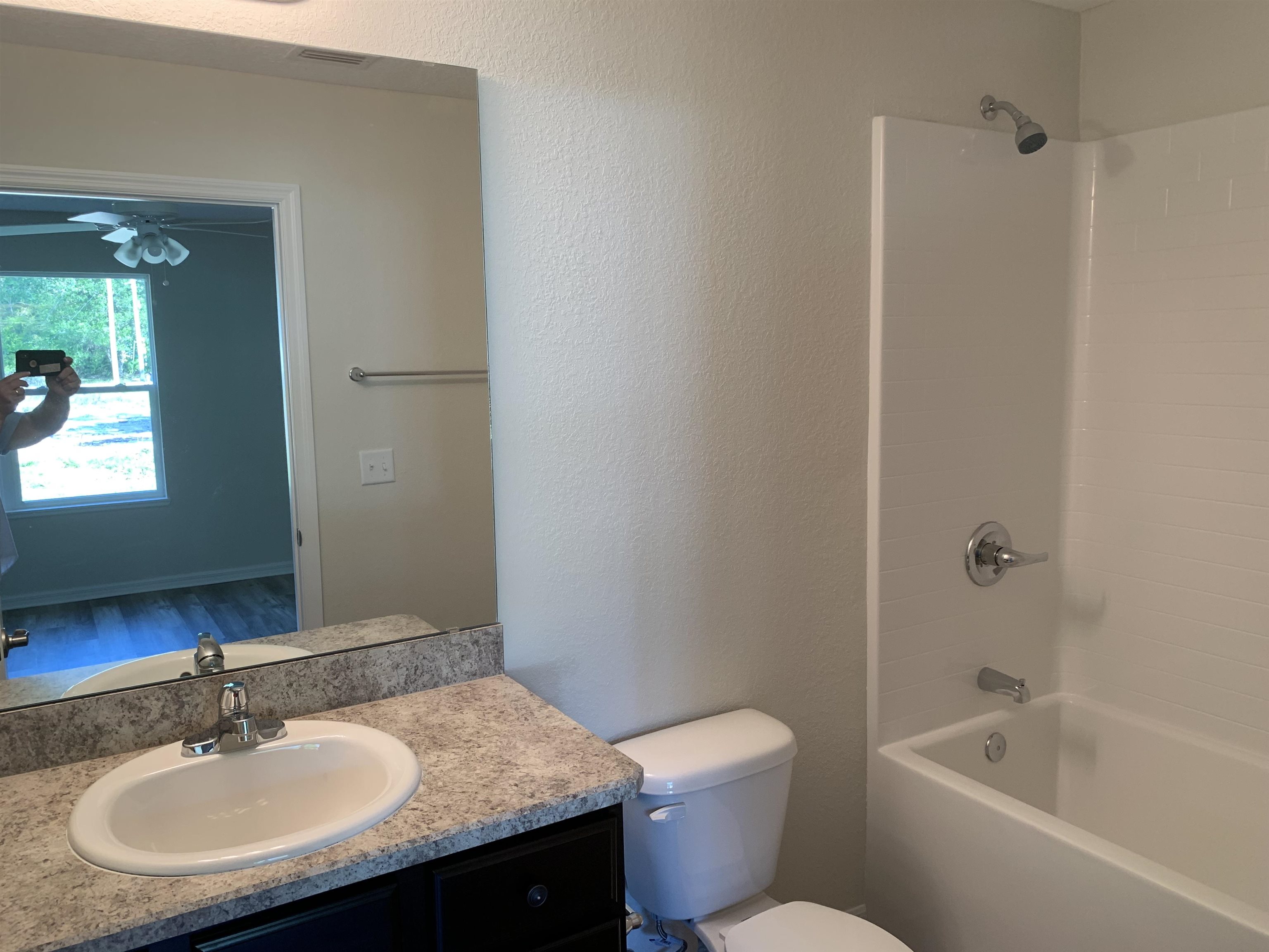 156 Gilbert Street St. Augustine, FL 32084 - Photo 21 of 35 a bathroom with a granite countertop sink toilet and shower