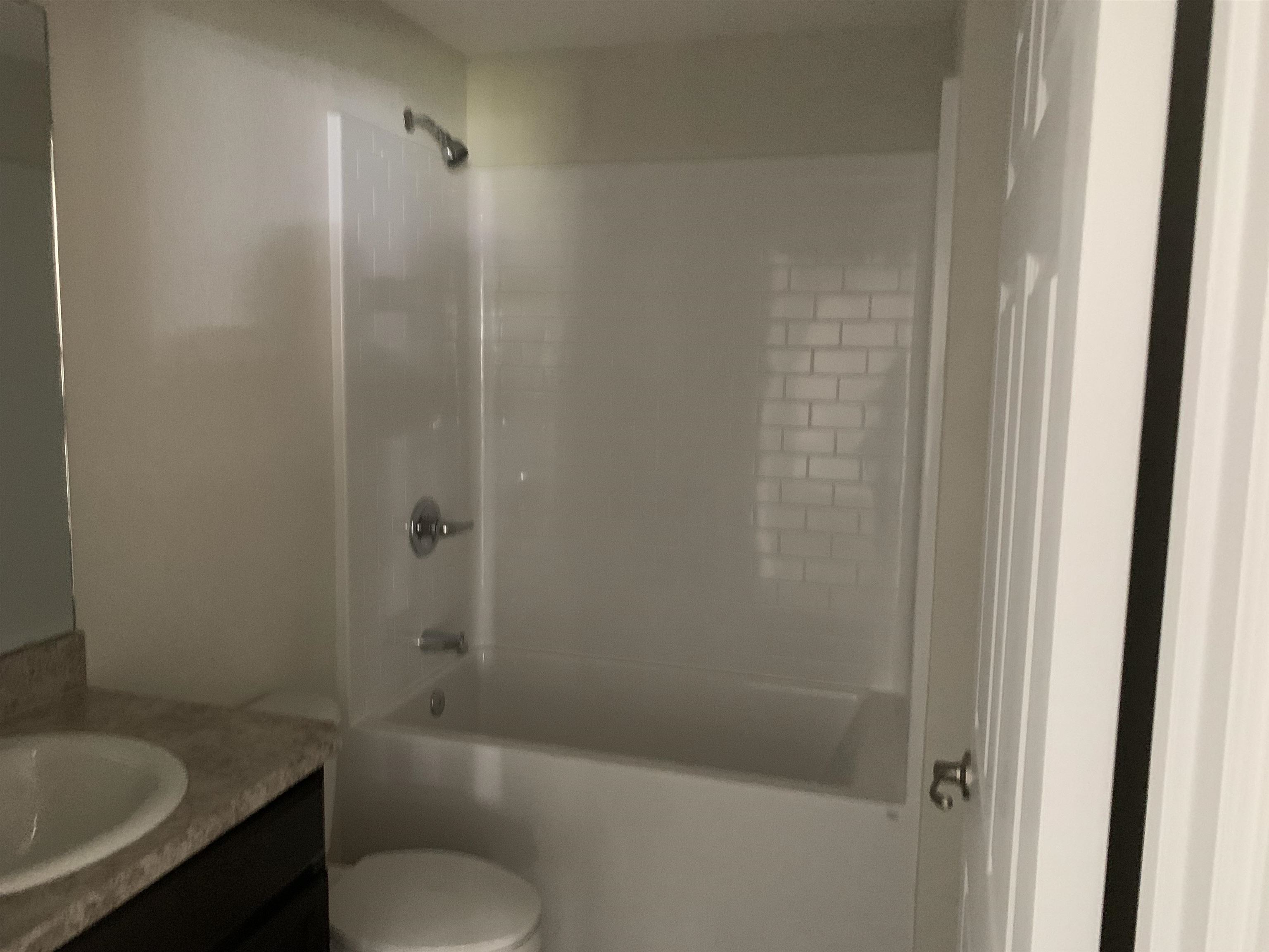 156 Gilbert Street St. Augustine, FL 32084 - Photo 26 of 35 a bathroom with a shower and toilet