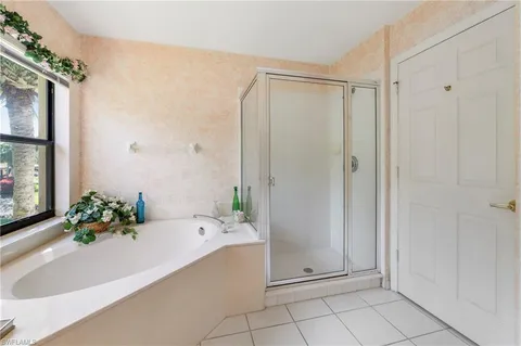 a bathroom with a bathtub and shower