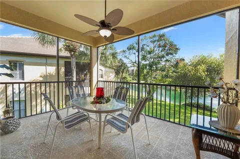 a view of a chairs and tables in the balcony