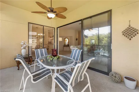 a dining room with furniture and a chandelier