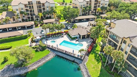 an aerial view of a house a yard and outdoor seating