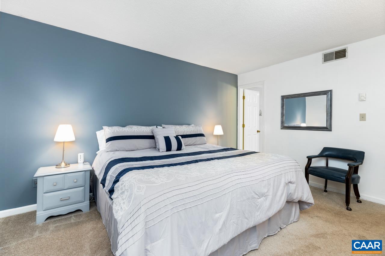 2029 Stone Ridge Wintergreen, VA 22967 - Photo 19 of 30 a bedroom with a bed and a chair
