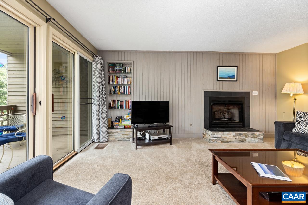 2029 Stone Ridge Wintergreen, VA 22967 - Photo 7 of 30 a living room with furniture and a flat screen tv