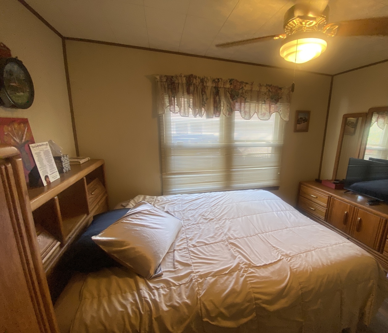 23 West 143rd Street Dixmoor, IL 60426 - Photo 20 of 30 a bedroom with a bed and a chandelier