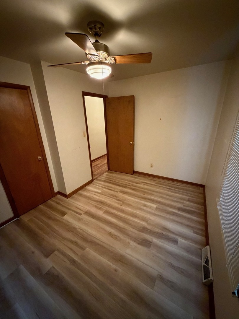 23 West 143rd Street Dixmoor, IL 60426 - Photo 28 of 30 a view of empty room with wooden floor