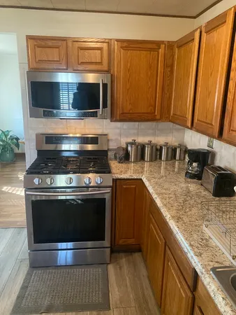 a kitchen with a stove and a microwave