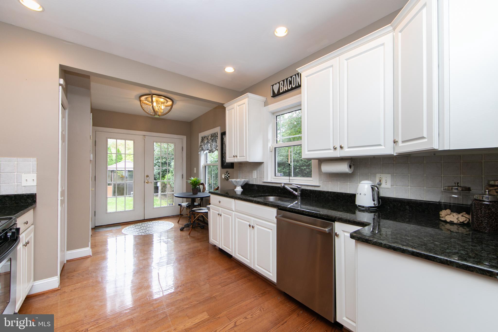 107 Centre Street Haddonfield, NJ 08033 - Photo 18 of 45 a kitchen with stainless steel appliances granite countertop a stove and a refrigerator