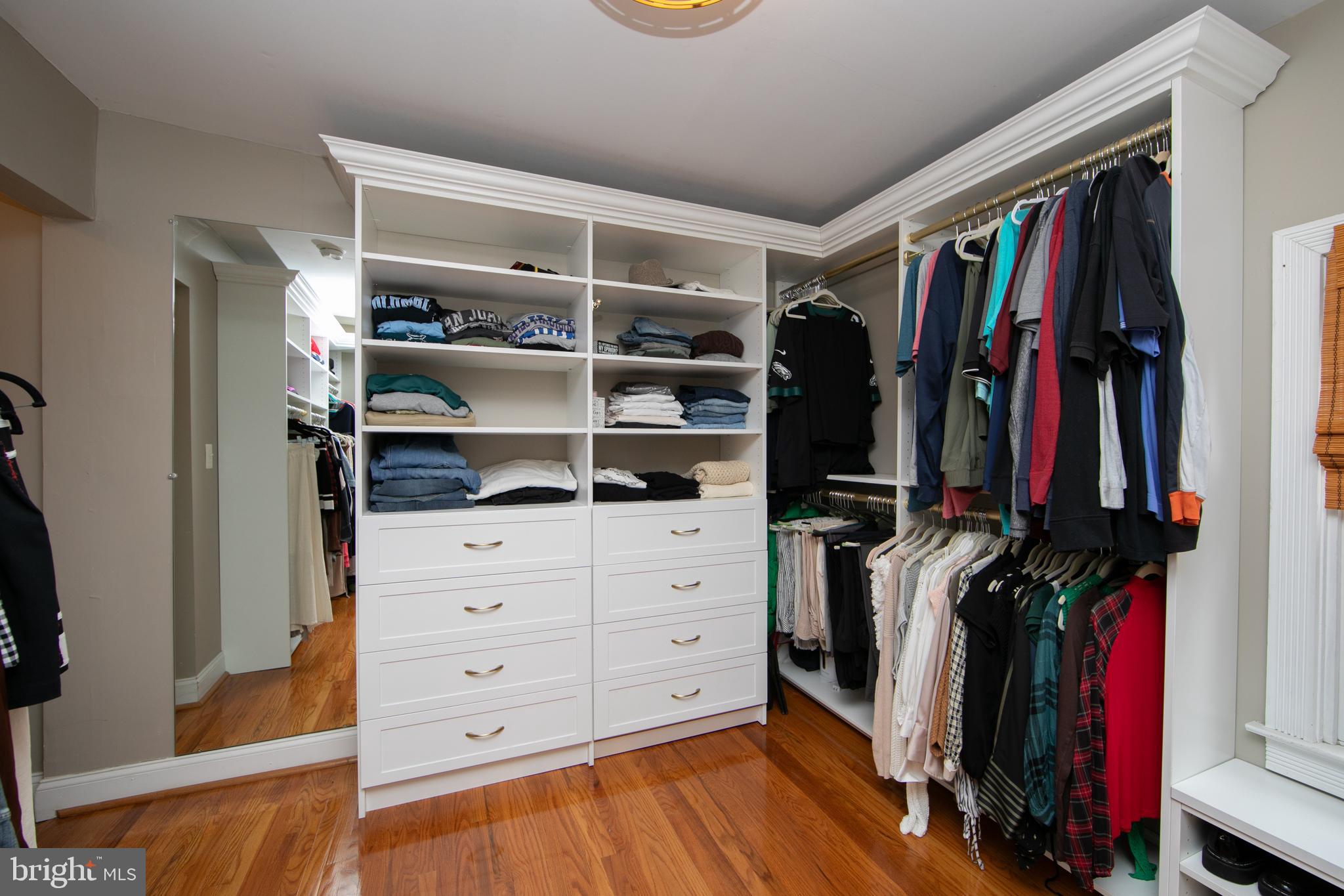 107 Centre Street Haddonfield, NJ 08033 - Photo 34 of 45 a view of walk in closet with clothes and shoes