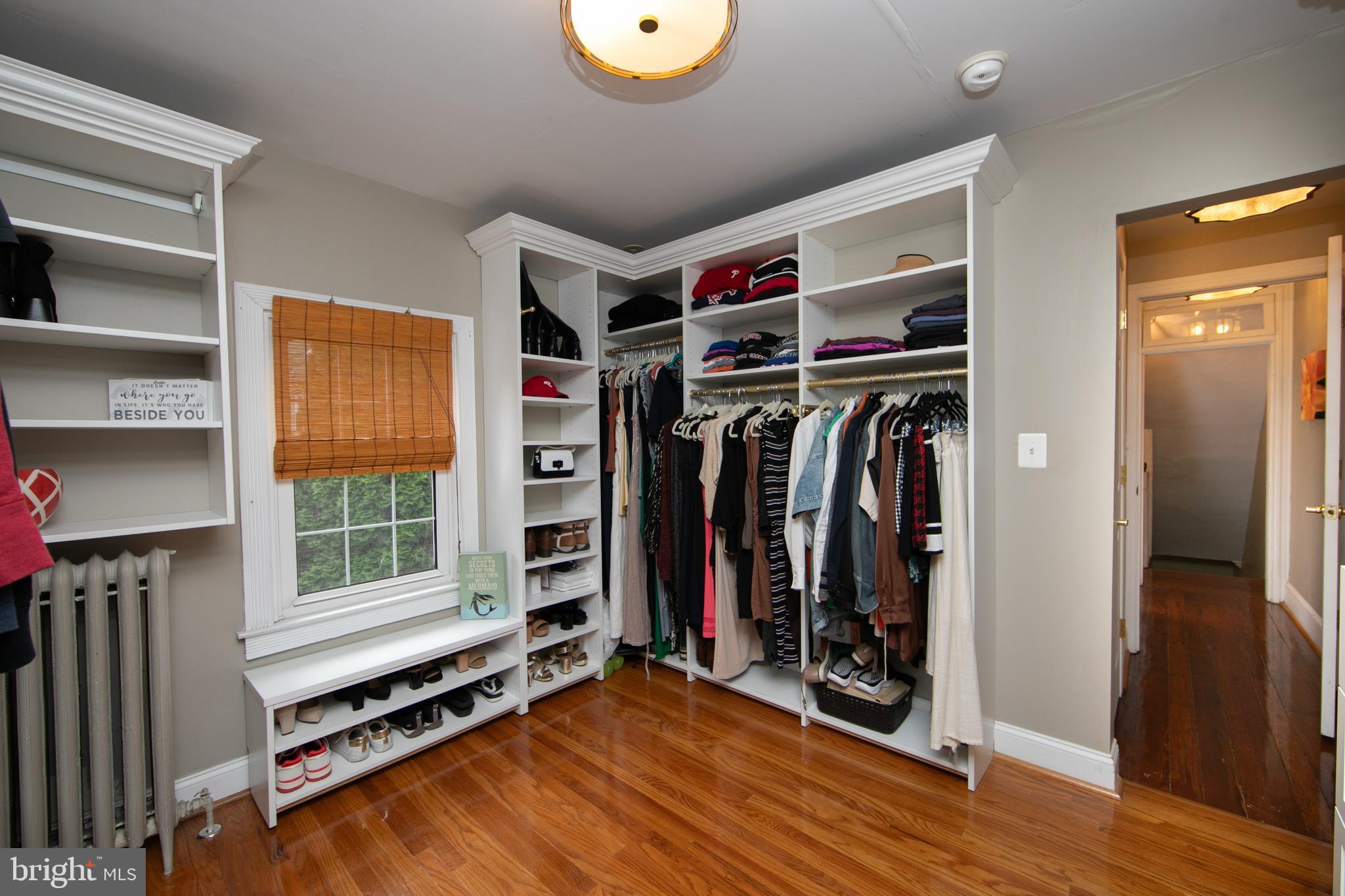 107 Centre Street Haddonfield, NJ 08033 - Photo 35 of 45 a view of walk in closet with clothes and shoes