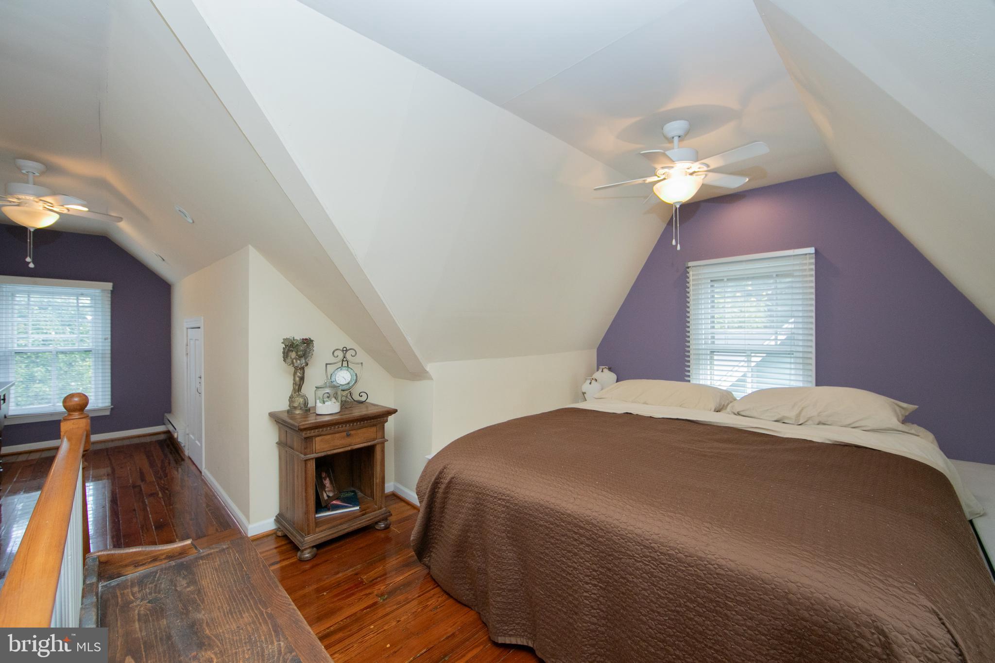 107 Centre Street Haddonfield, NJ 08033 - Photo 38 of 45 a bedroom with a bed and a fireplace