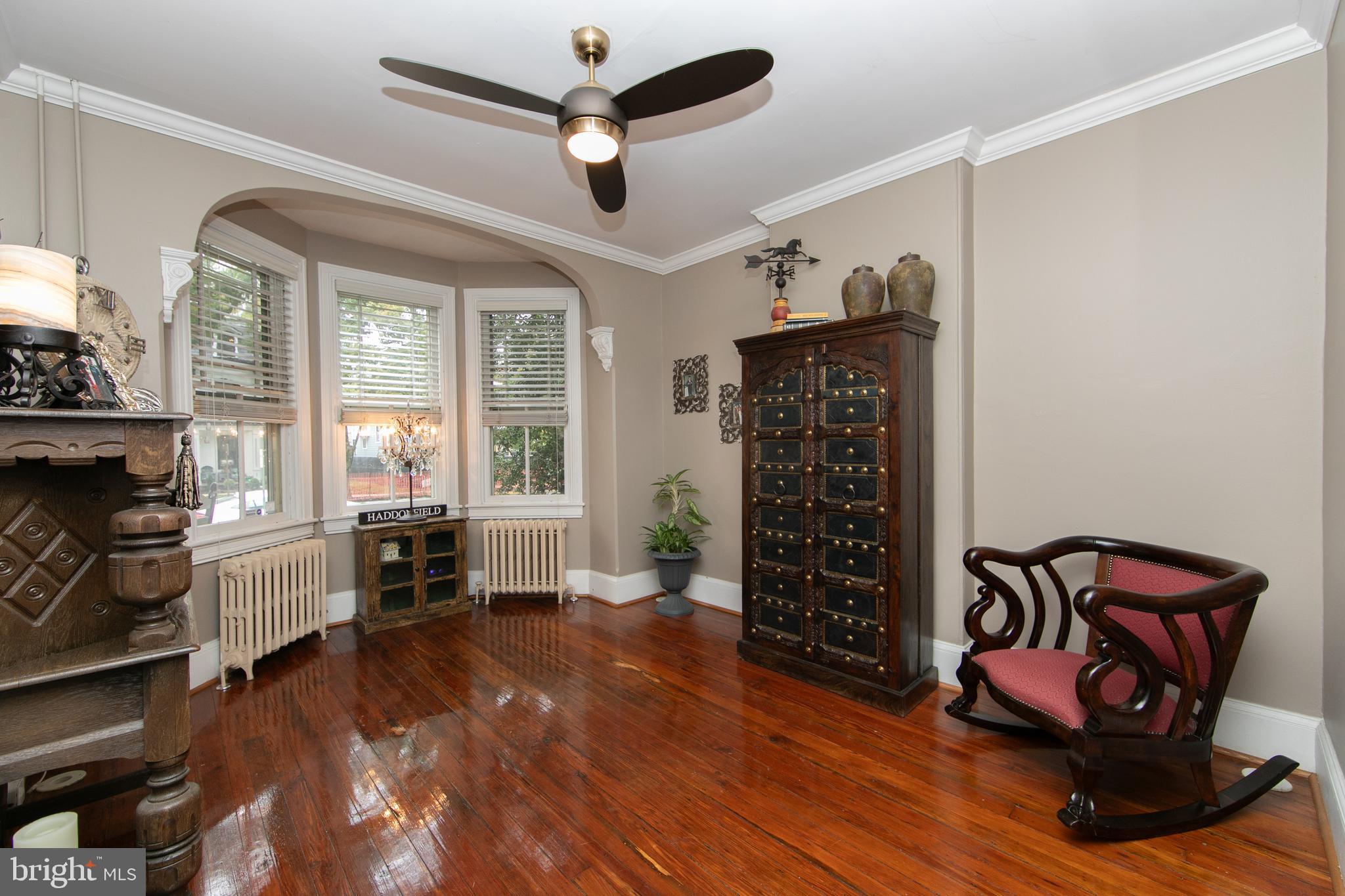 107 Centre Street Haddonfield, NJ 08033 - Photo 7 of 45 a view of a livingroom with furniture hardwood floor ceiling fan and windows