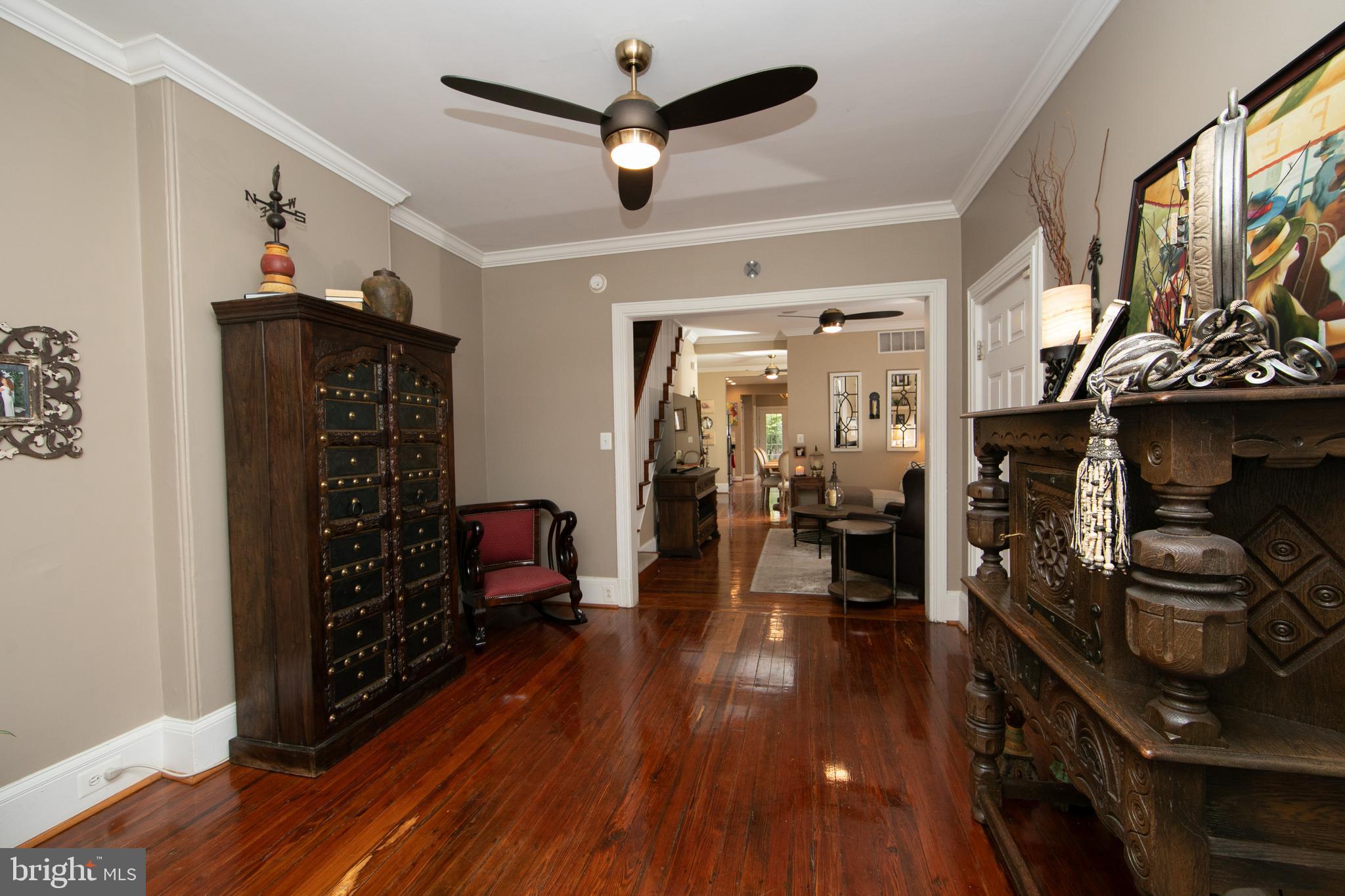 107 Centre Street Haddonfield, NJ 08033 - Photo 9 of 45 a view of a hallway with wooden floor and staircase