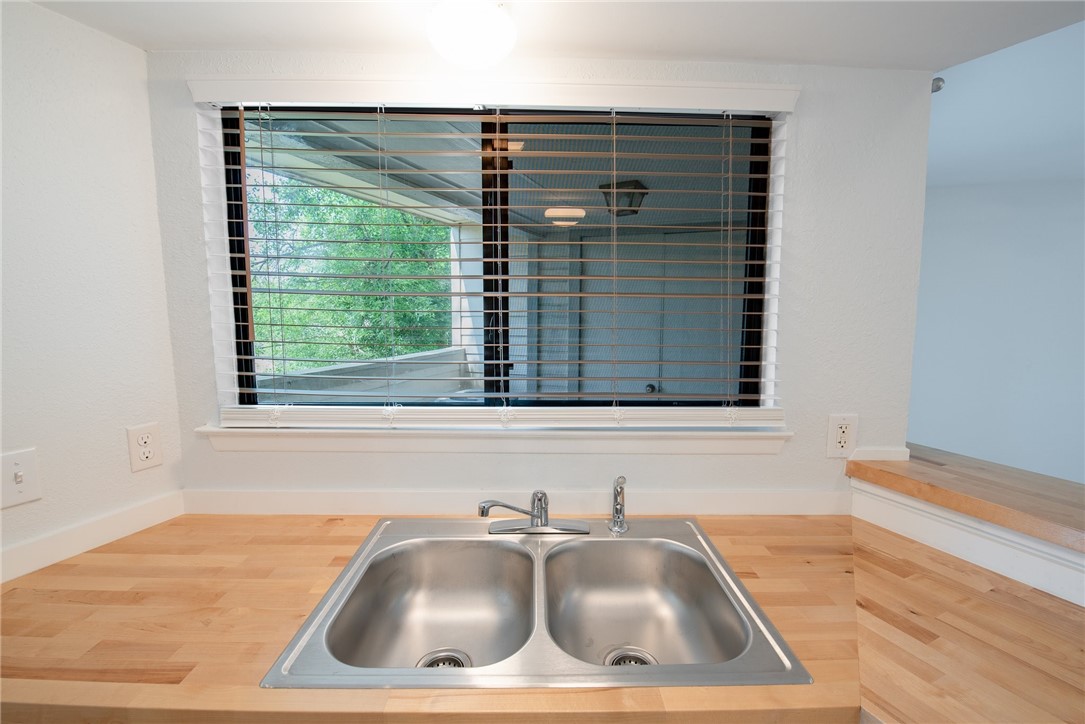 2500 Burleson Road, Unit 614 Austin, TX 78741 - Photo 9 of 20 a view of kitchen sink window and cabinets