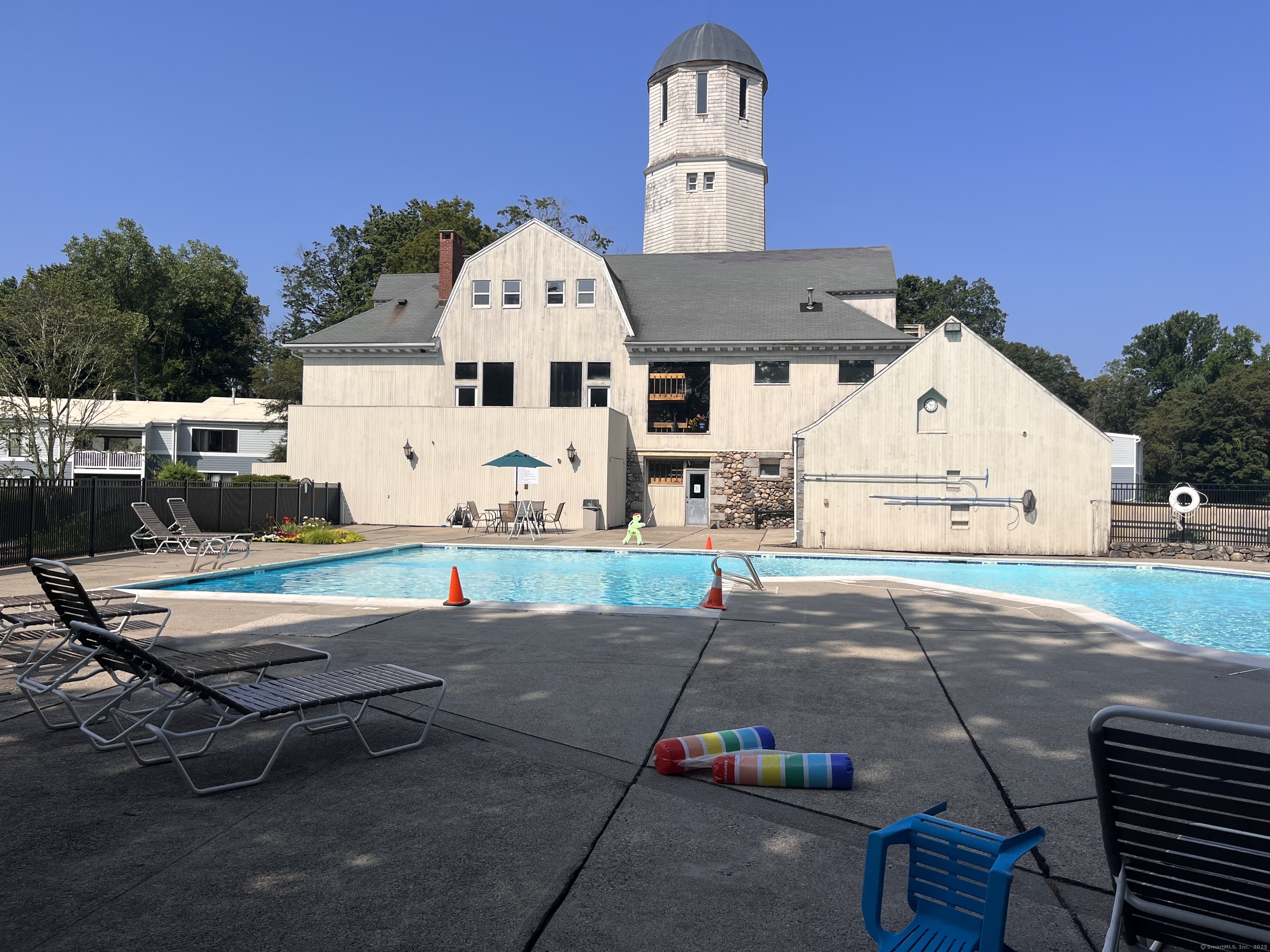 2 Cook Close, Unit 2 Ridgefield, CT 06877 - Photo 20 of 24 a view of a white house with a yard