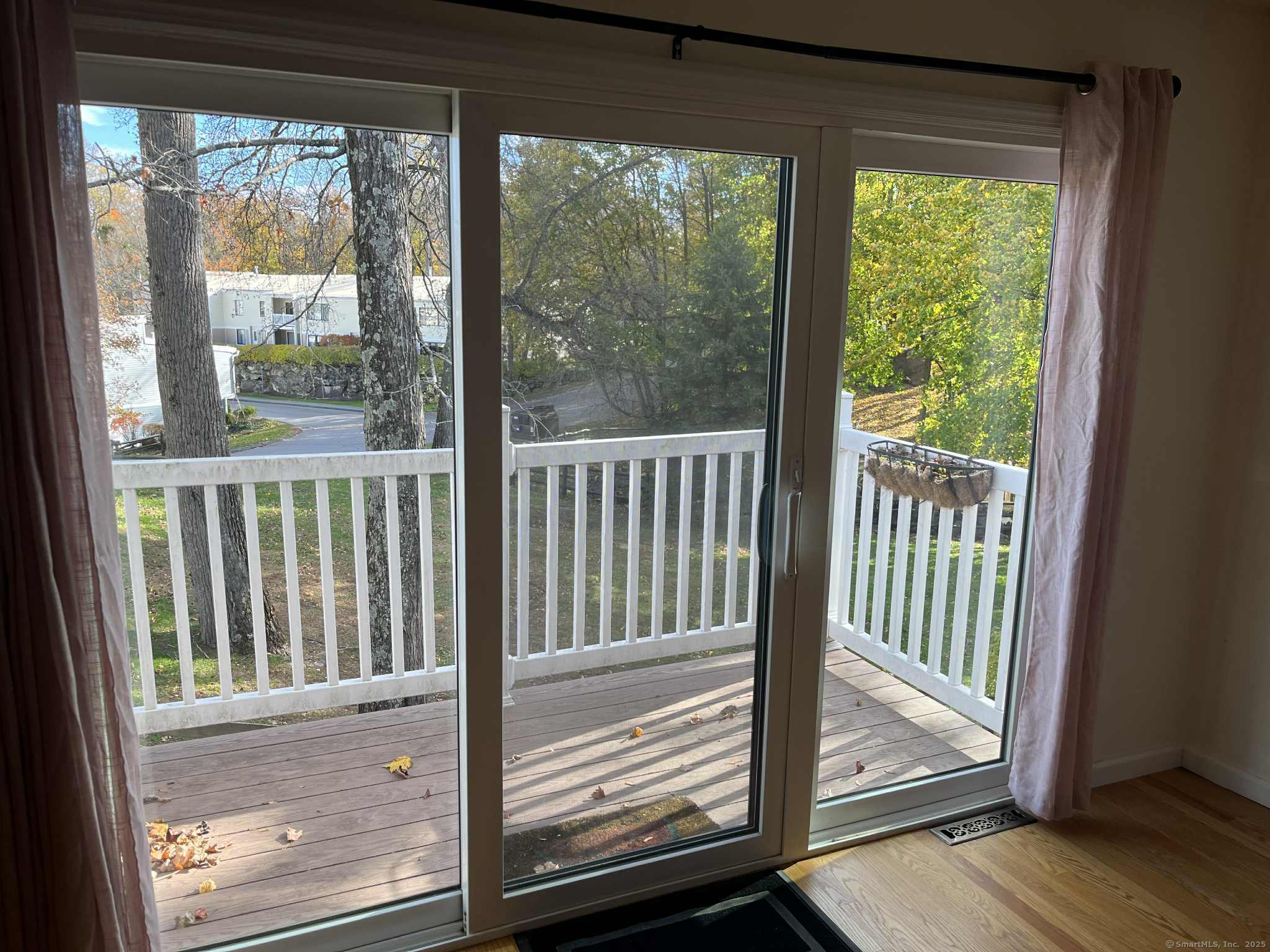 2 Cook Close, Unit 2 Ridgefield, CT 06877 - Photo 6 of 24 a view of a porch with a floor to ceiling window