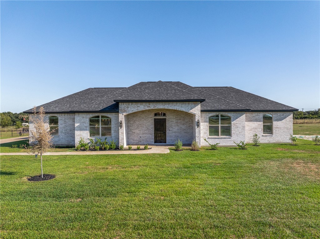 6524 Agave Court Bryan, TX 77808 - Photo 43 of 43 a front view of a house with a yard