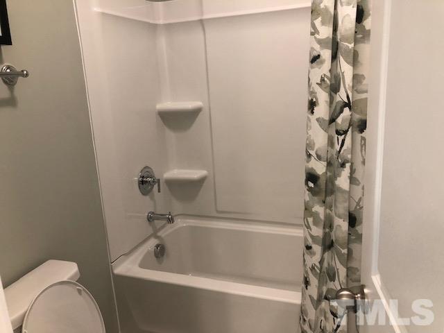 6000 Beale Loop Raleigh, NC 27616 - Photo 15 of 16 a bathroom with a sink a toilet and shower