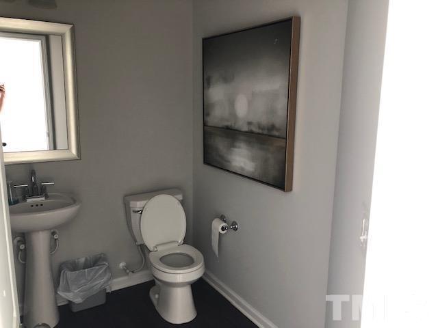 6000 Beale Loop Raleigh, NC 27616 - Photo 6 of 16 a bathroom with a toilet and a sink