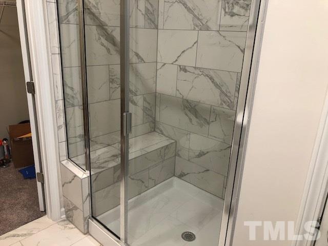 6000 Beale Loop Raleigh, NC 27616 - Photo 10 of 16 a bathroom with a glass shower door